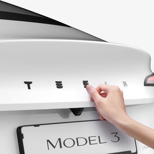 ACP08549 - Tesla Model 3 Highland Rear Emblem Logo Cover TO322H in Black showing the pressing of the logo cover
