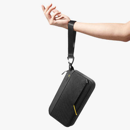 AFA07574 - Klasden Passport Organizer KD500 in Black showing the front while hanging on a person's wrist