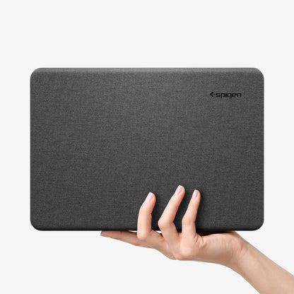 ACS11541 - MacBook Neo 13-inch Urban Fit in Black showing hand holding closed Urban Fit case in heather gray fabric