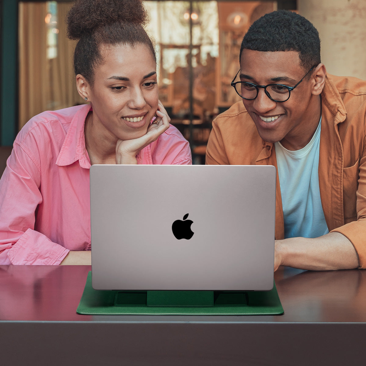 AFA06423 - MacBook Pro 14-inch Valentinus S Laptop Pouch in Jeju Green used as laptop stand with MacBook on desk