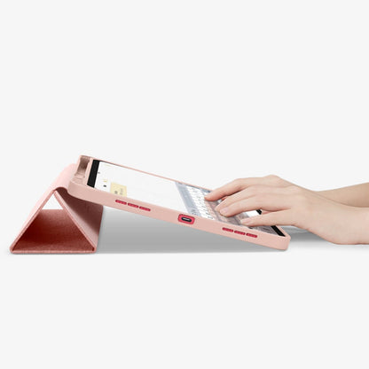 ACS05307 - iPad 10.9" Case Urban Fit in rose gold showing the bottom and partial front with device propped up and hands typing on screen