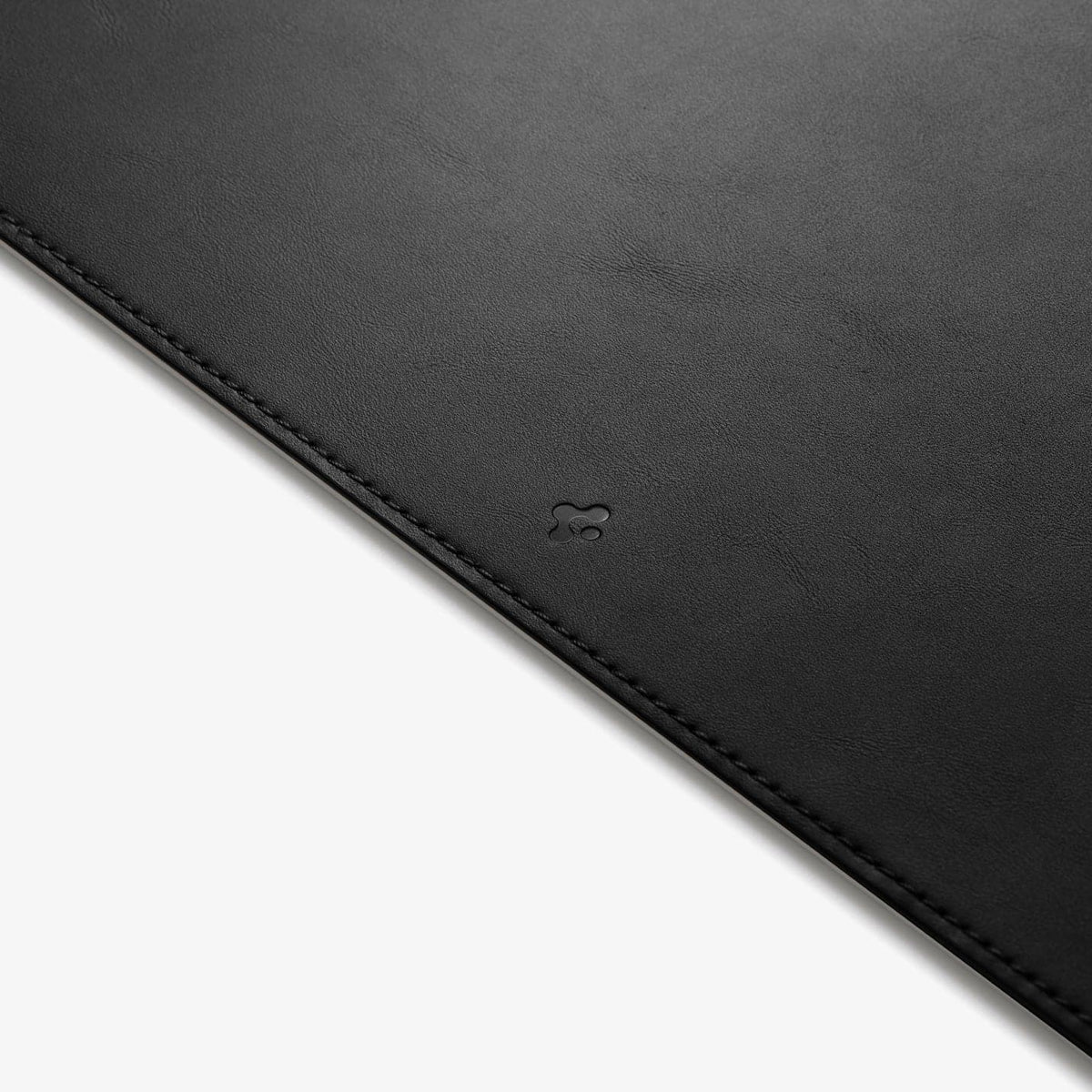 APP05267 - LD302M Magnetic Desk Pad in black showing the front zoomed in on Spigen logo
