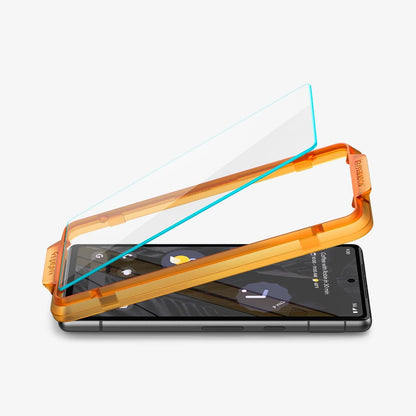 AGL05968 - Pixel 7a Screen Protector AlignMaster GLAS.tR showing the device laying flat and alignment tray with screen protector being installed onto it