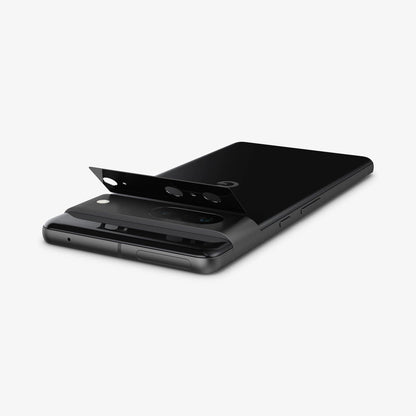 AGL05471 - Pixel 7 Optik Lens Protector in black showing the optik lens protector slightly hovering above camera lens
