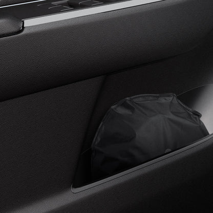 ACP09093 - R1S (2022-2025) Rivian CryoShade RO260 in Black showing the sunshade stored in a small space of the vehicle
