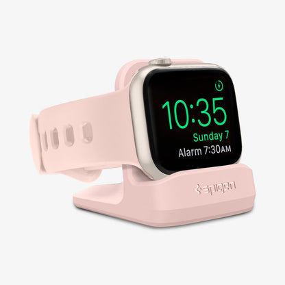000CD21183 - Apple Watch Night Stand S350 in pink showing the front and partial side with watch on stand