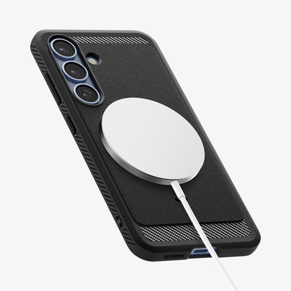 ACS08998 - Galaxy S25 Case Rugged Armor (MagFit) in Matte Black showing the back, partial side and bottom with magsafe charger attached