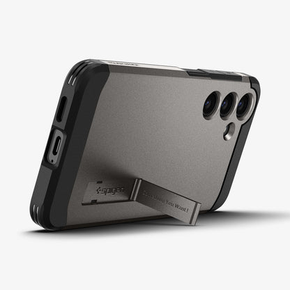 ACS07333 - Galaxy S24 Plus Case Tough Armor in Gunmetal showing the back, partial side and bottom with a built-in kickstand propped up