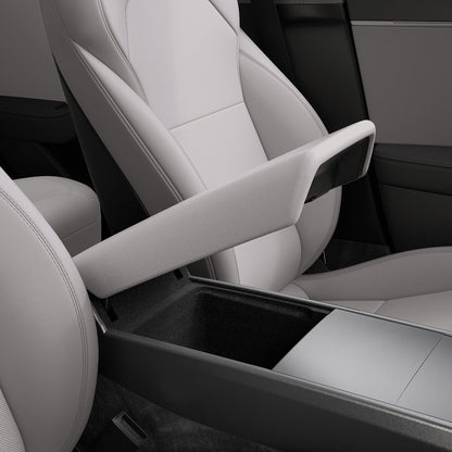 ACP12200 - Tesla Model Armrest Cover TO240H in Zen Gray showing the armrest cover lifted above the open center console storage compartment.
