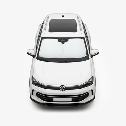 ACP11460 - Universal CryoShade UO260 M showing sunshade installed inside windshield of white volkswagen sedan viewed from front exterior