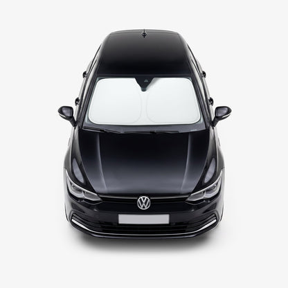 ACP11459 - Universal CryoShade UO260 S showing sunshade installed inside windshield of black volkswagen sedan viewed from front exterior