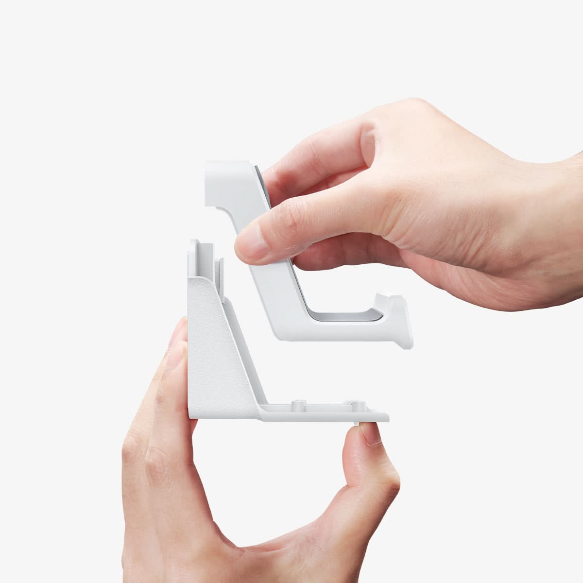 AMP06397 - PlayStation 5 Controller Mount | VG300 in White showing the side while a person's hand detaching its parts
