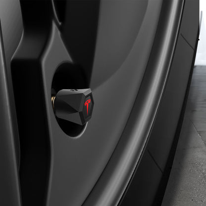 ACP11371 - Universal Tire Valve Stem Cap | VS100TS/R in Red showing a side view of the matte black hexagonal cap with red Tesla logo installed on a vehicle wheel valve stem.
