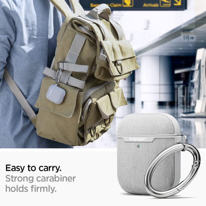 074CS27031 - Apple AirPods 1 / 2 Case Urban Fit in gray showing how it is easy to carry. Strong carabiner holds firmly