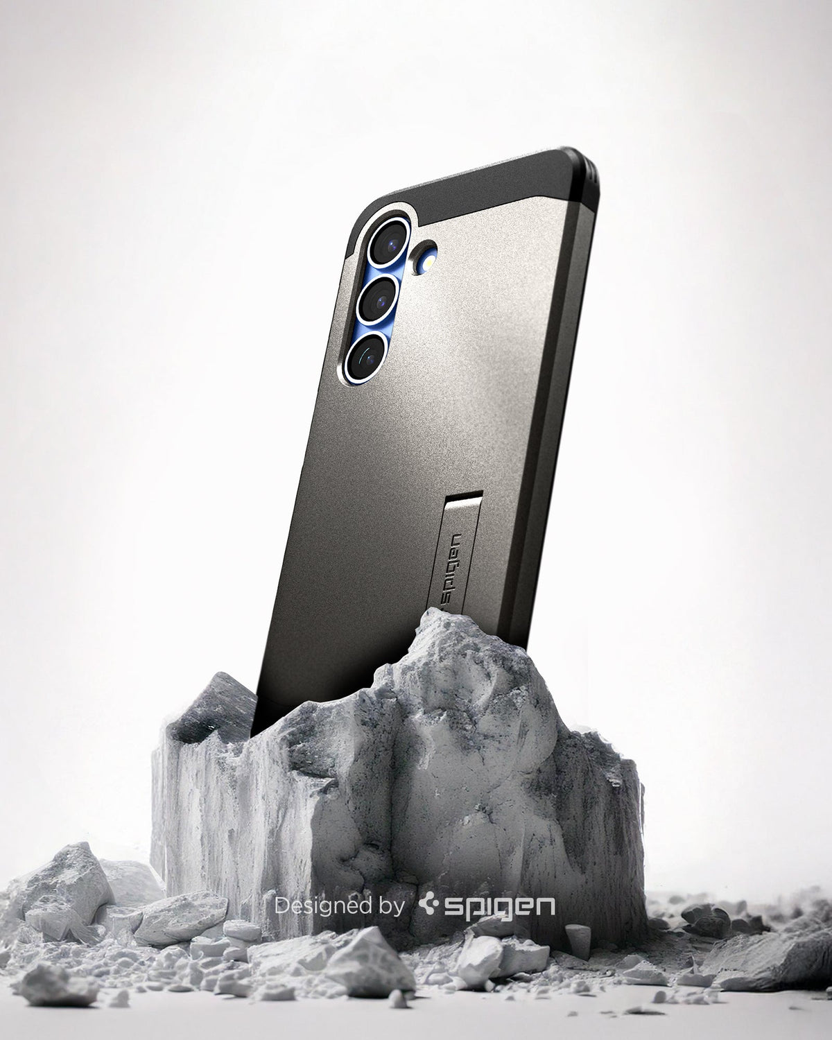 ACS08988 - Galaxy S25 Plus Case Tough Armor AI (MagFit) in Gunmetal showing the back, partial side device sitting on top of the rock