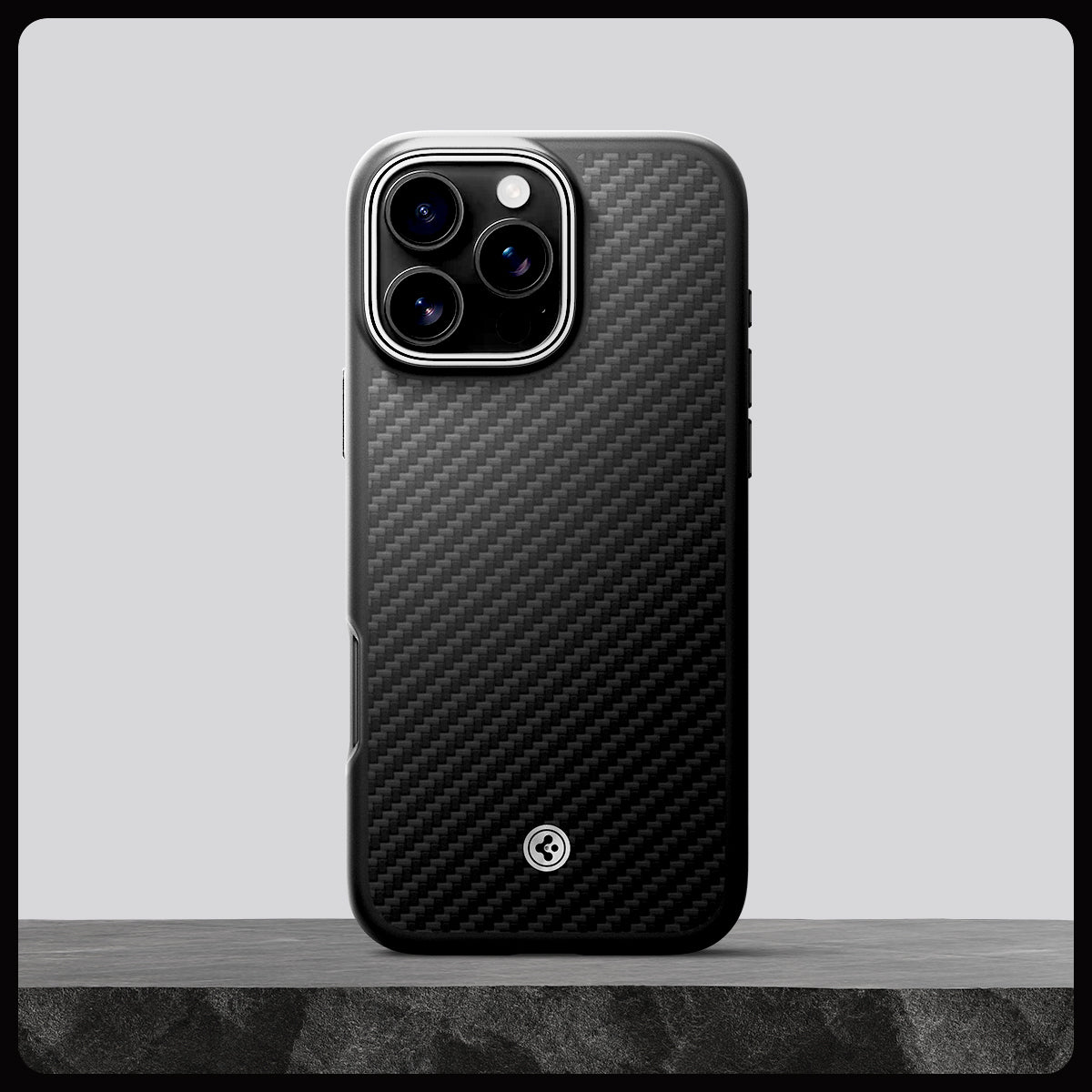 ACS08151 - iPhone 16 Pro Case Enzo Aramid in Black Silver showing whole case on the rock.