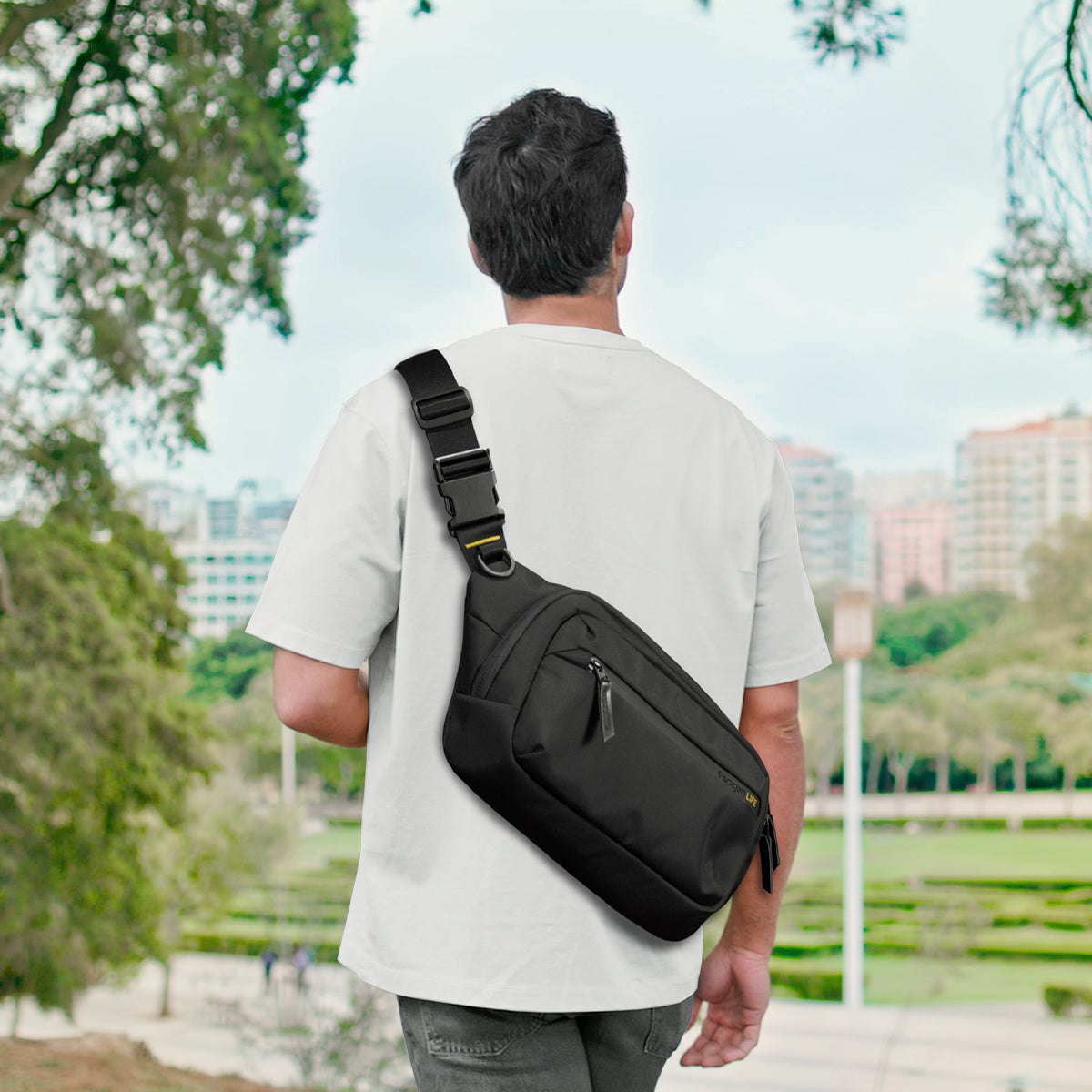 AFA07482 - Sling Bag KD410 in Black showing the bag on someone's back