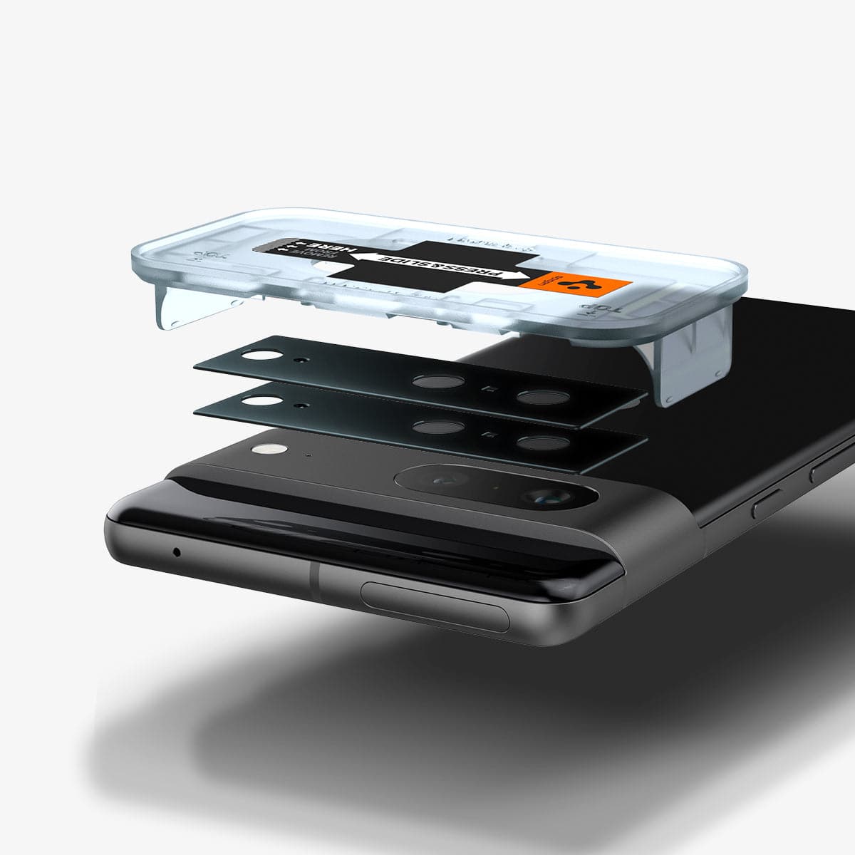 AGL05471 - Pixel 7 Optik Lens Protector in black showing the device, two optik lens protectors and ez fit tray